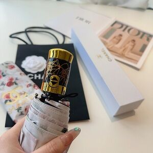 CHANEL Floral Umbrella with Gold and Red Details